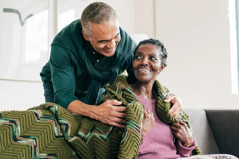 an elder patient being comforted by a loved one