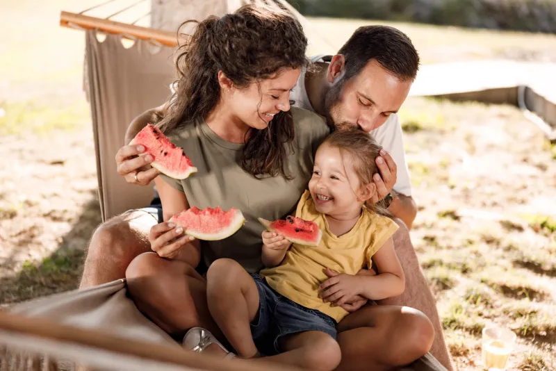 Family eating watermelon together