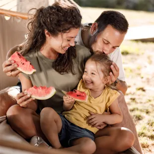Family eating watermelon together
